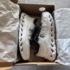 On Running White and Black Sneakers with Sleek Design